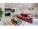 Open-concept living area with kitchen, island seating, and a comfortable seating arrangement at 301 Jetty Way, Davenport, FL 33897