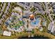 Bird's eye view of a waterpark with various pools, slides, and amenities with ample parking at 3191 Paradox Cir # 401, Kissimmee, FL 34746