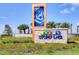 Close up of the Story Lake community sign with vibrant colors and tropical themed artwork at 3191 Paradox Cir # 401, Kissimmee, FL 34746