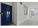 Apartment entrance featuring a dark blue door with a smart lock and a window to the right at 3191 Paradox Cir # 401, Kissimmee, FL 34746