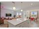 Spacious, open-concept kitchen with island, modern lighting, and seamless flow to living and dining areas at 3191 Paradox Cir # 401, Kissimmee, FL 34746