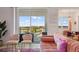 Comfortable living room showcasing a private balcony with scenic views, plush sofas, and modern decor at 3191 Paradox Cir # 401, Kissimmee, FL 34746