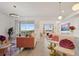 Stylish living room and dining area with modern decor, chandelier, and expansive views at 3191 Paradox Cir # 401, Kissimmee, FL 34746