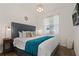 Cozy main bedroom with plush bedding, accent lamps, and a serene ambiance for relaxation at 3191 Paradox Cir # 401, Kissimmee, FL 34746