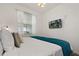 Comfortable main bedroom with soft lighting, modern decor, and view from the window at 3191 Paradox Cir # 401, Kissimmee, FL 34746