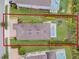 Aerial view of a backyard featuring a pool, patio furniture, and manicured landscaping at 321 Falls Dr, Kissimmee, FL 34747