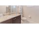This bathroom features granite countertops, a sink, and a toilet at 321 Falls Dr, Kissimmee, FL 34747