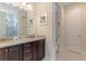 Bathroom featuring granite countertop vanity with double sinks and separate toilet room at 321 Falls Dr, Kissimmee, FL 34747