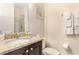 This bathroom features granite countertops, a sink, a toilet and a shower at 321 Falls Dr, Kissimmee, FL 34747