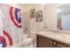 This bathroom features granite countertops, a tub/shower, a toilet, and a sink at 321 Falls Dr, Kissimmee, FL 34747