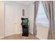 Bedroom with Arcade Game, door and carpet at 321 Falls Dr, Kissimmee, FL 34747