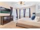 Bedroom featuring a comfortable bed, neutral carpet, and sliding glass door to exterior at 321 Falls Dr, Kissimmee, FL 34747