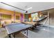 Game room featuring ping pong, pool table, basketball, and a playful cartoon mural at 321 Falls Dr, Kissimmee, FL 34747