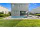 View of the backyard showcasing the pool and spa area at 321 Falls Dr, Kissimmee, FL 34747