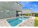 Backyard pool and spa area with brick pavers and lounge chairs at 321 Falls Dr, Kissimmee, FL 34747
