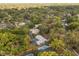 An aerial view of the community shows the residence, pool and surrounding homes in a desirable, lush, neighborhood at 345 W Hornbeam Dr, Longwood, FL 32779