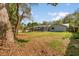 The expansive backyard showcases the screened-in pool enclosure, creating a private retreat for relaxation and outdoor enjoyment at 345 W Hornbeam Dr, Longwood, FL 32779
