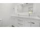 Modern bathroom with double vanity, illuminated mirror, and updated fixtures at 345 W Hornbeam Dr, Longwood, FL 32779