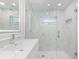 Updated bathroom featuring a glass enclosed shower with marble tiling and modern fixtures at 345 W Hornbeam Dr, Longwood, FL 32779