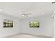 Bright bedroom featuring large windows overlooking the yard and fresh paint at 345 W Hornbeam Dr, Longwood, FL 32779