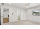 Bright bedroom with fresh paint, new carpet, a ceiling fan, and ensuite bathroom at 345 W Hornbeam Dr, Longwood, FL 32779