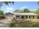 Charming single-story home features a well-maintained front yard and attached garage with lovely curb appeal at 345 W Hornbeam Dr, Longwood, FL 32779