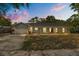 Charming single-story home with a manicured lawn and attached garage, perfect for suburban living at 345 W Hornbeam Dr, Longwood, FL 32779