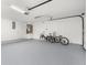 Spacious garage with epoxy flooring and bicycles at 345 W Hornbeam Dr, Longwood, FL 32779