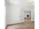 Bright living room featuring hardwood floors, fresh paint and a brick fireplace at 345 W Hornbeam Dr, Longwood, FL 32779