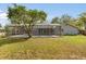 A screened pool enclosure enhances outdoor living with ample space for recreation and relaxation in the backyard at 345 W Hornbeam Dr, Longwood, FL 32779
