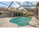 A screened-in pool features crystal blue water and offers a refreshing escape in a private backyard oasis at 345 W Hornbeam Dr, Longwood, FL 32779