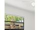 Window with blinds overlooks lush greenery at 345 W Hornbeam Dr, Longwood, FL 32779