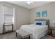 Charming bedroom with a cozy bed, decorative pillows, and ample natural light for a peaceful retreat at 3456 Shallow Cove Ln, Clermont, FL 34711