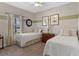 Cozy bedroom with twin beds, natural light, and tasteful decor offers a comfortable space at 3456 Shallow Cove Ln, Clermont, FL 34711