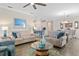 Spacious living room and dining area featuring modern decor, comfortable seating, and an open layout at 3456 Shallow Cove Ln, Clermont, FL 34711