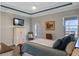 Serene main bedroom featuring water views, a walk-out to a patio, and a light airy ambiance at 3456 Shallow Cove Ln, Clermont, FL 34711