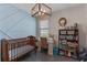Versatile office space featuring built-in shelving, a desk area, and stylish decor suitable for a home office or study at 3456 Shallow Cove Ln, Clermont, FL 34711