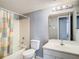 Clean bathroom featuring a shower-tub combo, single sink vanity, and neutral color palette at 3700 Idlebrook Cir # 114, Casselberry, FL 32707