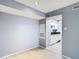 Open living room area with view to updated kitchen with white cabinetry at 3700 Idlebrook Cir # 114, Casselberry, FL 32707