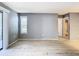 Living room with sliding glass doors to the exterior, wood grain flooring and view to closet at 3700 Idlebrook Cir # 114, Casselberry, FL 32707