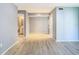 Bright living room featuring wood grain floors, bathroom and living room views at 3700 Idlebrook Cir # 114, Casselberry, FL 32707