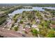 Aerial view of the neighborhood showcases the lake, community layout, and proximity to amenities at 3994 Irma Shores Dr, Orlando, FL 32817