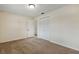 Clean bedroom with carpet flooring, closet with bi-fold doors and neutral paint at 3994 Irma Shores Dr, Orlando, FL 32817