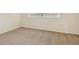 Neutral bedroom with carpet, window, and fresh paint at 3994 Irma Shores Dr, Orlando, FL 32817