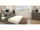 Modern bedroom showcasing neutral colors, stylish decor, and ample natural light at 3994 Irma Shores Dr, Orlando, FL 32817