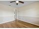Bedroom showing two-tone walls, wood-look flooring and a closet at 3994 Irma Shores Dr, Orlando, FL 32817