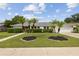 Charming single Gathering home with a well-manicured lawn and mature landscaping, including palm trees at 3994 Irma Shores Dr, Orlando, FL 32817