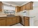Kitchen featuring a modern black sink, stainless steel appliances, and light wood cabinetry at 3994 Irma Shores Dr, Orlando, FL 32817