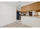 Bright kitchen featuring modern appliances, breakfast bar, and tile flooring at 3994 Irma Shores Dr, Orlando, FL 32817