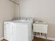 Clean laundry room featuring washer, dryer, and utility sink at 3994 Irma Shores Dr, Orlando, FL 32817